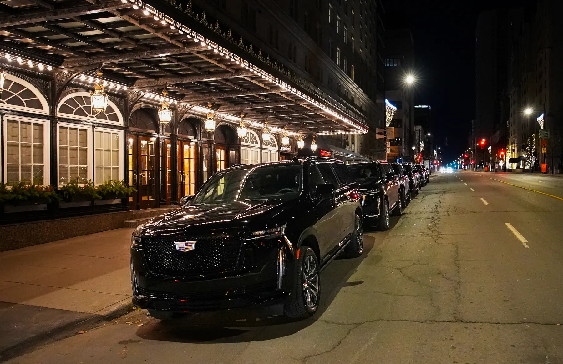 VIP Lane Montreal limo fleet outside a hotel at night
